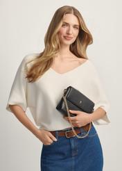 Small leather women's handbag TORES-1278-9I(W26), front view of the product on a model, half of the silhouette visible.