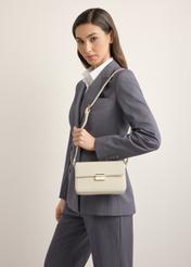 Elegant cream women's handbag TOREC-1251-0B(Z26), front view of the product on a model. Half of the silhouette visible.