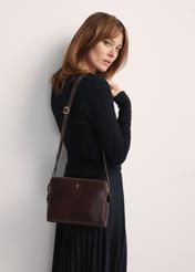 Brown leather women's handbag TORES-1141-89(Z25) - front view of the product on a model on a white background. Half of the silhouette visible.