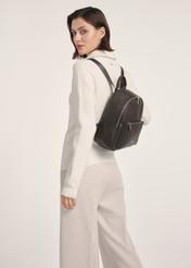 Dark brown women's backpack TOREC-0996A-89(Z25), front view of the product on a model, half of the silhouette visible.