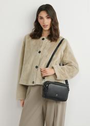 Small black leather women's handbag TORES-1023A-99(W26), front view of the product on the model's shoulder. Half of the silhouette visible.