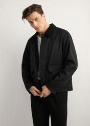 Men's black transitional jacket KURMT-0419-99(W26) - front product view, modeled, against a light background. Knee-length silhouette visible.