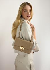 Small women's handbag in camel color TOREC-1186-1D(W26) - front view of the product, on a model, against a light background. Half of the silhouette visible.