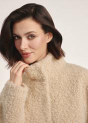 Beige women's fur coat FUTDP-0061-81(Z25) - front view of the product on a model against a white background. Close-up.