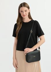 Black leather handbag TORES-1079D-99(W25), diagonal view of the product on the model. Half of the silhouette visible.