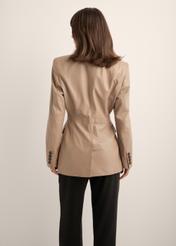 Beige women's leather jacket KURDS-0647-1K(Z26), back view of the product on the model. Half of the silhouette visible.