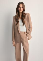 Women's camel blazer ZAKDT-0031A-1D(W26) - front view of the product, on a model, against a light background. Knee-length silhouette visible.