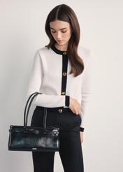 Elegant black women's handbag TOREC-1065-99(Z25) - front view of the product on a model, against a white background. Knee-length silhouette visible.