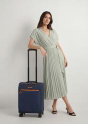 Medium suitcase on wheels WALNY-0045-7D-24(W26), front view of the product next to the model's silhouette.