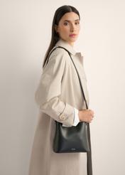 Black small women's handbag TOREC-1336-99(Z26), front view of the product on the model, half of the silhouette visible.