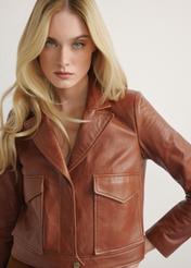 Women's short leather jacket in camel color KURDS-0471-1D(W26), front view of the product on the model. Half of the silhouette visible.