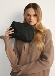 Black women's cosmetic bag TOREN-0267A-99(Z25), front view of the product on a model, half of the silhouette visible.