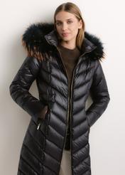 Women's jacket with raccoon fur (KURDT-0712-99(Z26)), front view on a model. Half-body shot.