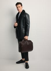 Brown leather men's laptop bag TORMS-0482-89(Z25) - front view of the product, held by the model. Full body view.
