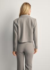 Short women's jacket in grey ZAKDT-0044-91(Z25), product view from the back on the model, half of the silhouette visible.
