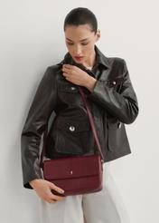 Women's burgundy leather messenger bag TORES-1245-4C(W26) - front view, on a model, on a white background.