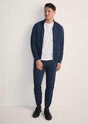 Men's navy blue trousers SPOMT-0111-68(Z25), front view of the product on the model. Full body visible.
