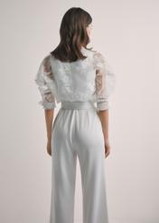 Women's white lace shirt KURDT-0637-0A(W26), back view of the product on the model. Half of the silhouette visible.