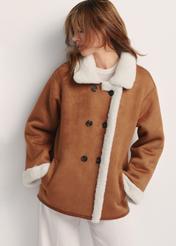 Women's sheepskin coat in camel color KOZDP-0013-24(Z25) - front view of the product on a model on a white background. Half of the silhouette visible.
