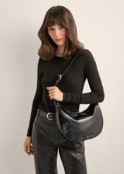 TORES-1366-9F(Z26), women's glossy hobo bag. Front view of the product on a model. Half of the silhouette visible.