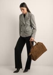 Cognac leather women's shopper bag TORES-1412-1F(Z26) - a slightly diagonal view of the bag, held by the model, against a light background. The entire silhouette is visible.