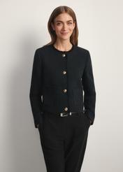 Women's black short blazer ZAKDT-0041-99(W26), front view of the product on the model. Half of the silhouette visible.