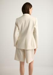 Women's white wool-blend blazer ZAKDT-0045-0B(W26), back view of the product on the model. Half of the silhouette visible.