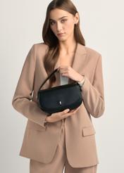 Small black women's messenger bag TOREC-1185-99(W26), product view in model's hands. Half silhouette visible.