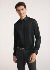 Black men's shirt KOSMT-0351A-99(Z26) - front view of the product on a model on a white background. Half of the silhouette visible.