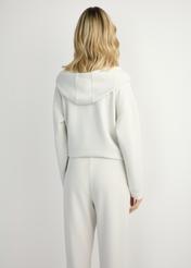 Light beige women's hooded sweatshirt BLZDT-0111A-1A(W26), back view of the product on the model. Half of the silhouette visible.