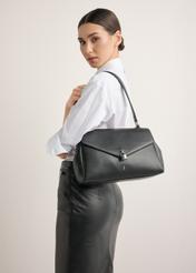Black women's shoulder bag TOREC-1389-99(Z26), front view of the product on a model. Half of the silhouette visible.