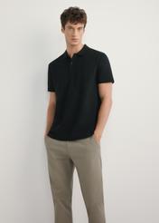 Men's black polo shirt POLMT-0084-99(W26) - front view of the product, on a model, against a light background. Full body visible.