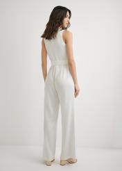 Cream women's jumpsuit KOBDT-0012-0B(W26), back view of the product on the model. Full body visible.