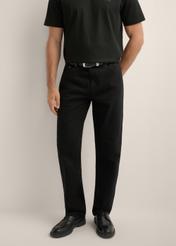 Men's black jeans JEAMT-0025-99(Z26), front view of the product on the model. Half of the silhouette visible.