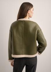 Women's short khaki sheepskin coat KOZDP-0015-8D(Z26), product view from the back on the model. Half of the silhouette visible.
