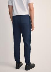 Men's navy blue trousers SPOMT-0111-68(Z25), rear view of the product on the model. Half of the silhouette visible.