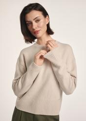 Beige women's sweater SWEDT-0242-80(Z25), front view of the product on the model. Half of the silhouette visible.