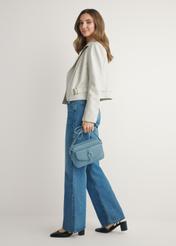 Blue small women's handbag TOREC-1175-7C(W26) - front view of the product, on a model, against a light background. The entire silhouette is visible.