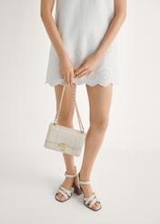 Women's cream leather sandals BUTYD-1177-0B(W26) - front view of the product, on a model, against a light background. Half-length silhouette visible.