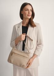Beige women's shoulder bag TORES-1213-1B(W26), product view in model's hands. Half of silhouette visible.