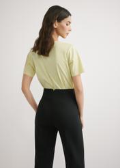 Light yellow women's basic T-shirt TSHDT-0120-2A(W26), back view of the product on the model. Half of the silhouette visible.