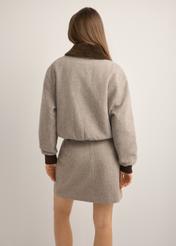 Women's short beige wool jacket PLADT-0077-1B(Z26), back view of the product on the model. Half of the silhouette visible.