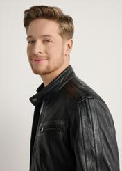 Men's black leather jacket KURMS-0397-99(W26) - close-up of the model, on a light background.