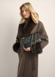 Elegant black women's shoulder bag TORES-1399-9P(Z26), front view of the product on a model. Half of the silhouette visible.