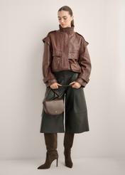 Women's brown leather messenger bag TORES-1352-1H(Z26), diagonal view of the product on the model. Full body visible.