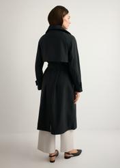 Women's black long coat KURDT-0653-99(W26), product view from the back on the model. Full body visible.