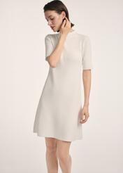 Cream women's dress SUKDT-0243-12(Z25), product visible from the front on the model, half of the silhouette visible.
