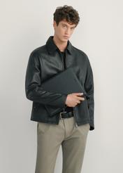 Men's black leather briefcase TORMS-0410R-9I(W26), front view of the product on the model, half of the silhouette visible.