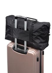 Black travel bag TORMN-0382-99(Z25), product view from the back on a suitcase on a white background.