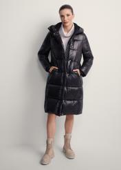 Black long women's winter jacket KURDT-0531A-99(Z25), product view from the front on the model, the whole silhouette is visible.